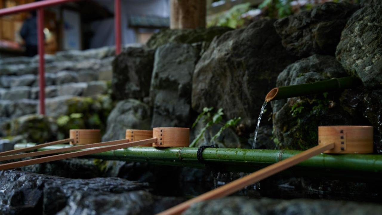 The Thousand Киото Экстерьер фото A tsukubai at a shrine